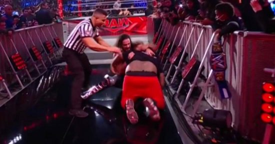 Video: Fan jumps barricade, attacks Seth Rollins during WWE Raw
